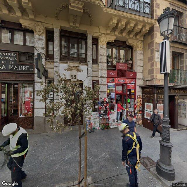 Street view near Antigua Farmacia De La Reina Madre in Madrid