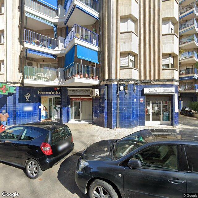 Street view near Farmàcia Colomina Brusau, M. Rosa in Barcelona