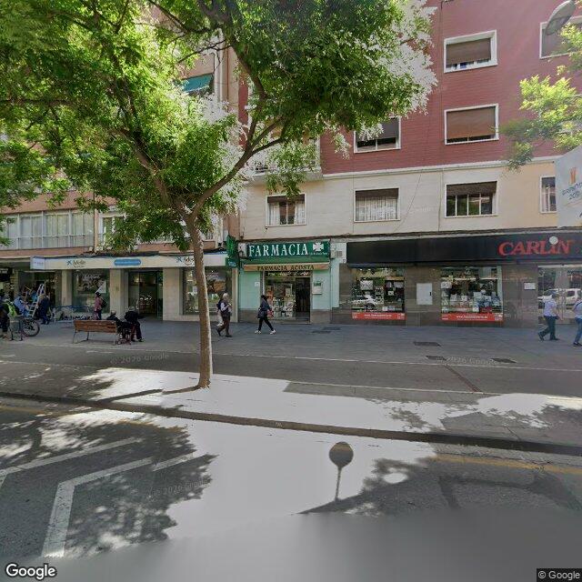 Street view near Farmacia Acosta in Granada