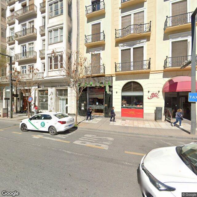Street view near Farmacia Aguilera in Granada