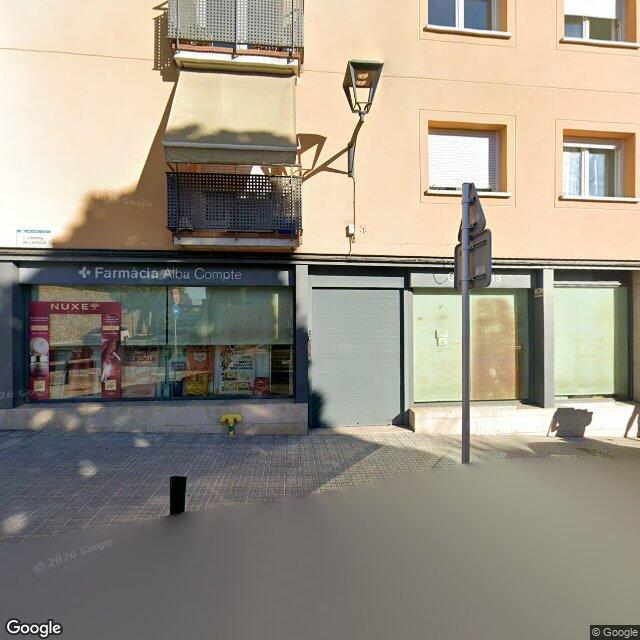 Street view near Farmacia Alba Comte in Barcelona