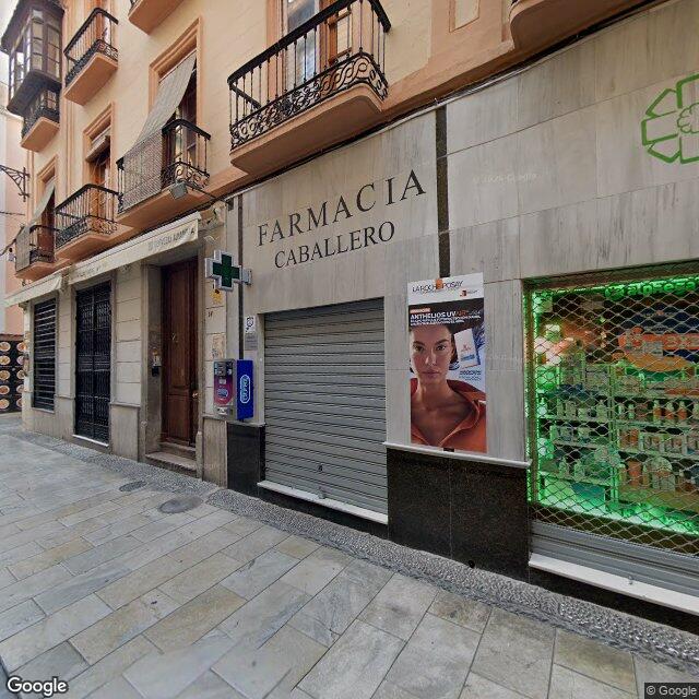Street view near Farmacia Caballero in Granada