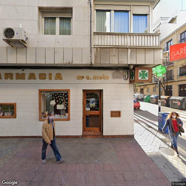 Street view near Farmacia Melchor Almagro in Granada