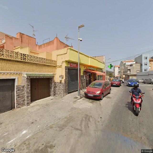 Street view near Farmacia Príncipe Alfonso in Spain