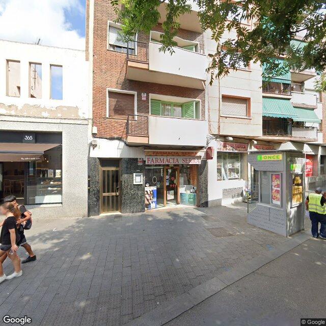 Street view near Farmacia Serra in Spain